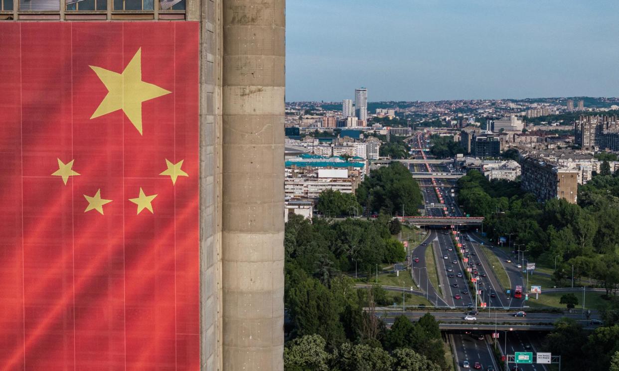 <span>A Chinese flag hangs from a building in Belgrade, Serbia, before President Xi Jinping’s visit this week.</span><span>Photograph: Marko Đurica/Reuters</span>