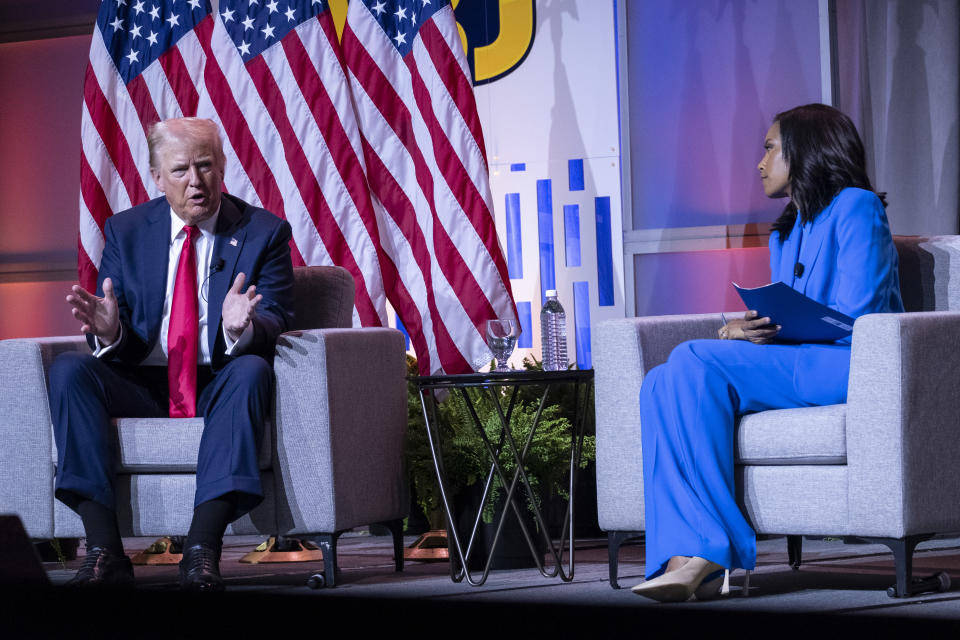 Former President Donald Trump is interviewed by Rachel Scott, senior congressional correspondent for ABC News, at the National Association of Black Journalists Annual Convention in Chicago on July 31. (Joel Angel Juarez for The Washington Post via Getty Images)