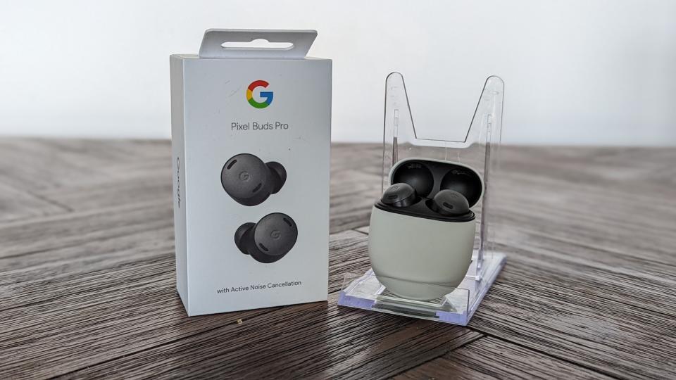 The Google Pixel Buds Pro with its packaging on a brown wooden table. (Photo: Yahoo Lifestyle Singapore)