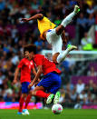 MANCHESTER, ENGLAND - AUGUST 07: Kim Hyunsung of Korea clashes with Alex Sandro of Brazil during the Men's Football Semi Final match between Korea and Brazil, on Day 11 of the London 2012 Olympic Games at Old Trafford on August 7, 2012 in Manchester, England. (Photo by Stanley Chou/Getty Images)