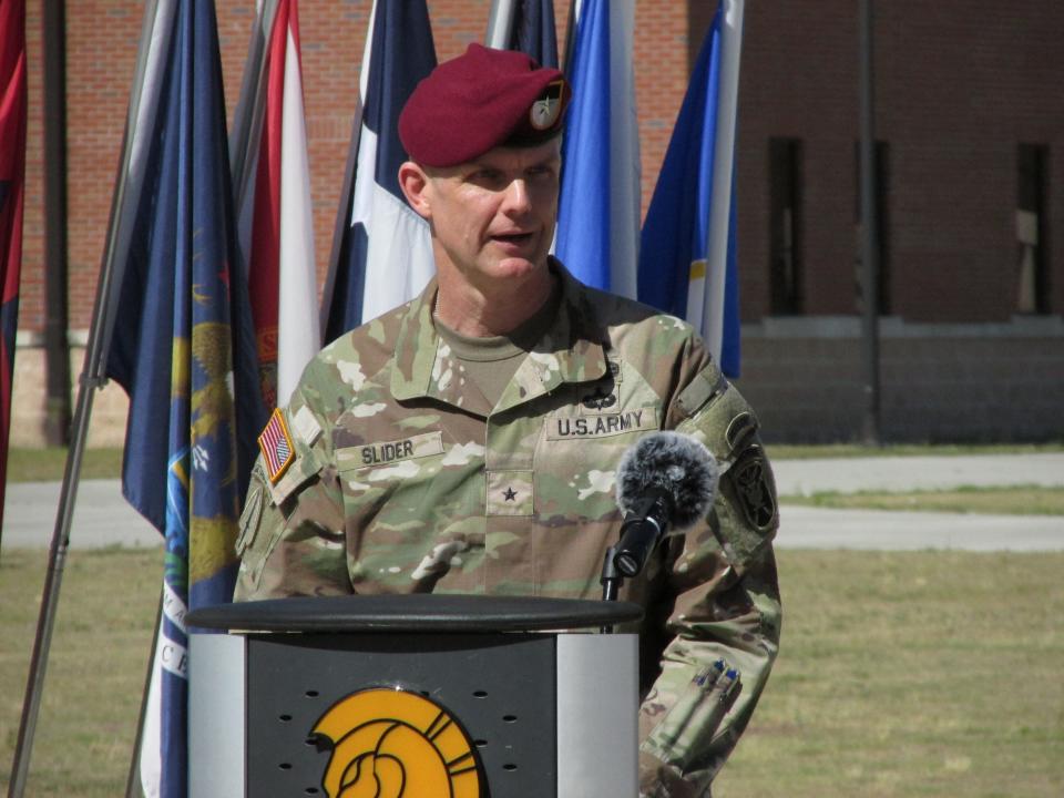 Brig. Gen. Jason Slider, incoming commander for the John F. Kennedy Special Warfare Center and School, makes remarks during a command change ceremony Friday, June 21, 2024, at Fort Liberty.