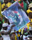 Cameroon fans celebrate a goal scored by captain Vincent Aboubakar during the African Cup of Nations 2022 group A soccer match between Cameroon and Burkina Faso at the Olembe stadium in Yaounde, Cameroon, Sunday, Jan. 9, 2022. (AP Photo/Themba Hadebe)