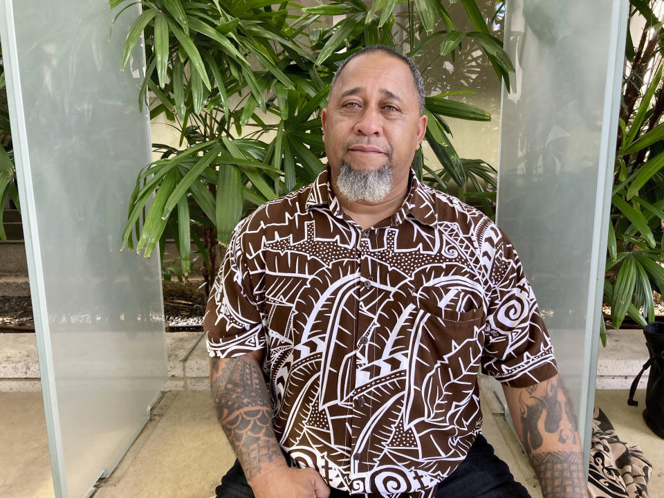 Chico Kaonohi poses for a photo outside U.S. District Court in Honolulu, Thursday, Nov. 17, 2022, after his Native Hawaiian son was found guilty of a hate crime in the 2014 beating of a white man. U.S. District Judge J. Michael Seabright ordered Kaulana Alo-Kaonohi and Levi Aki Jr. detained pending sentencing scheduled for March 2, 2023. (AP Photo/Jennifer Sinco Kelleher)
