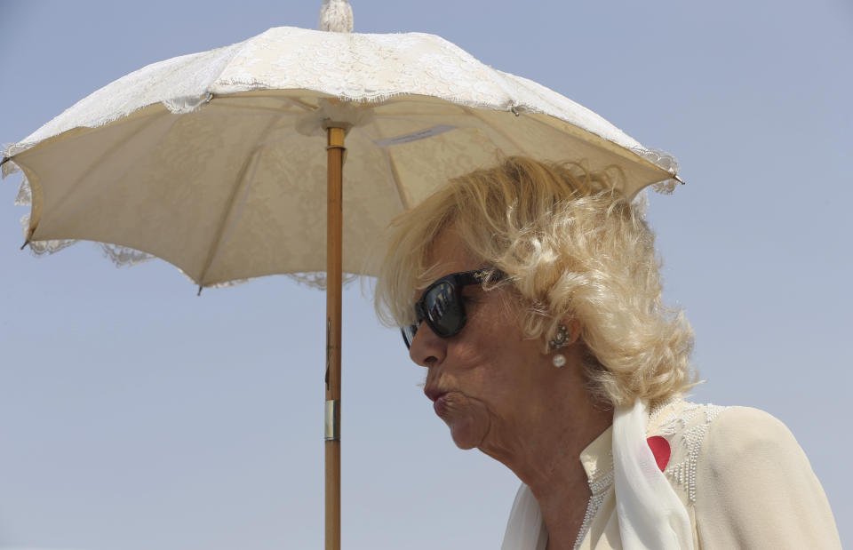 FILE - Camilla, Duchess of Cornwall gestures during her visit to the International Humanitarian City in Dubai, United Arab Emirates, Tuesday, Nov. 8, 2016. Britain's queen consort, Camilla, has come a long way. On May 6, she will be crowned alongside her husband and officially take her first turns on the world stage as Queen Camilla. It’s been a remarkable and painstakingly slow transformation over five decades. Camilla was long reviled as the other woman in Charles' marriage to Diana and considered a liability to the British monarchy. (AP Photo/Kamran Jebreili, File)