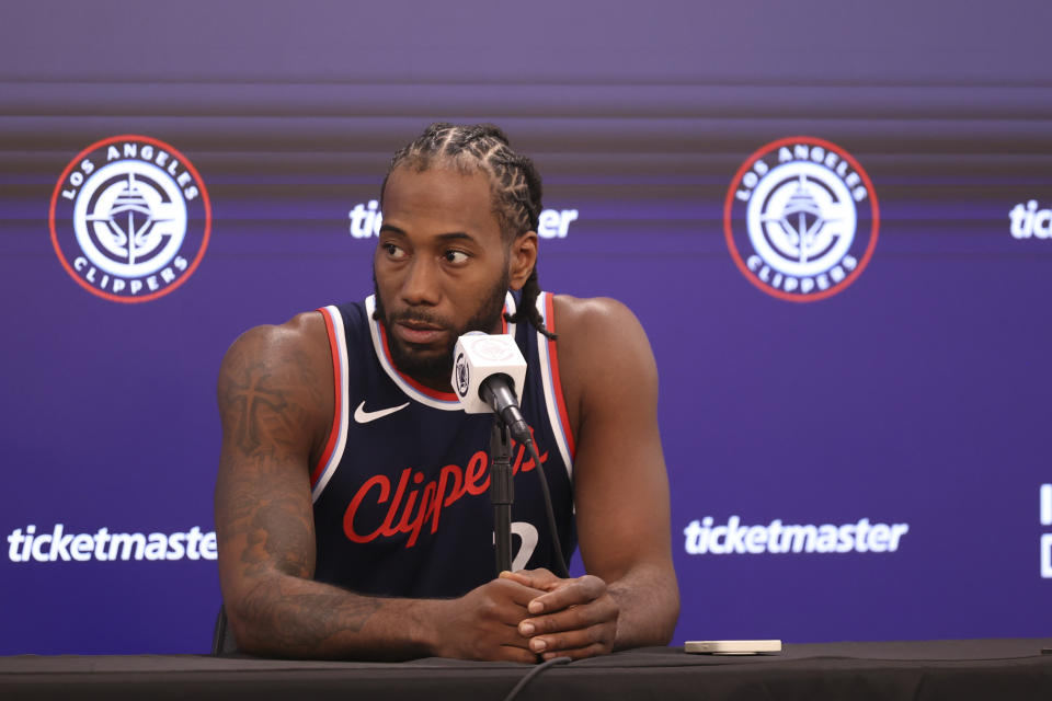 Kawhi Leonard plans to play in the Clippers' season opener. But as usual with his health, it is not certain that he will. (Associated Press)