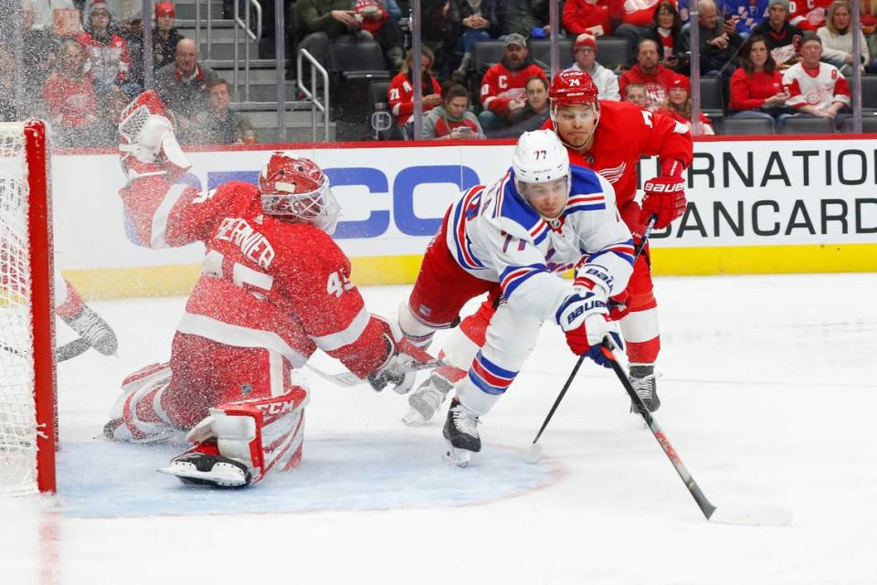 Detroit Red Wings goaltender Jonathan Bernier (45) stops a shot by New York Rangers’ Tony DeAngelo (77) as Madison Bowey (74) defends during the third period of an NHL hockey game Saturday, Feb. 1, 2020, in Detroit. (AP Photo/Paul Sancya)