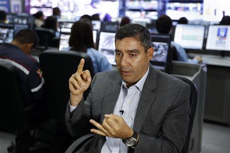 Venezuela's Interior and Justice Minister and intelligence service head Miguel Rodriguez Torres speaks during an interview with Reuters in Caracas December 11, 2013. REUTERS/Carlos Garcia Rawlins