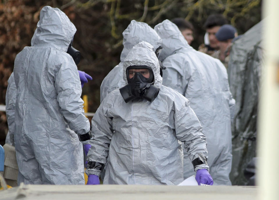 Investigators in protective clothing near Salisbury, England. (Andrew Matthews/PA via AP)