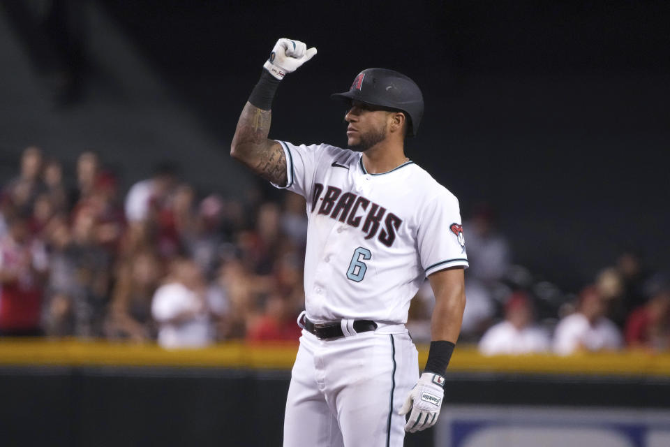 Arizona Diamondbacks' David Peralta reacts after hitting a double against the Los Angeles Angels during the fourth inning of a baseball game Friday, June 11, 2021, in Phoenix. (AP Photo/Rick Scuteri)