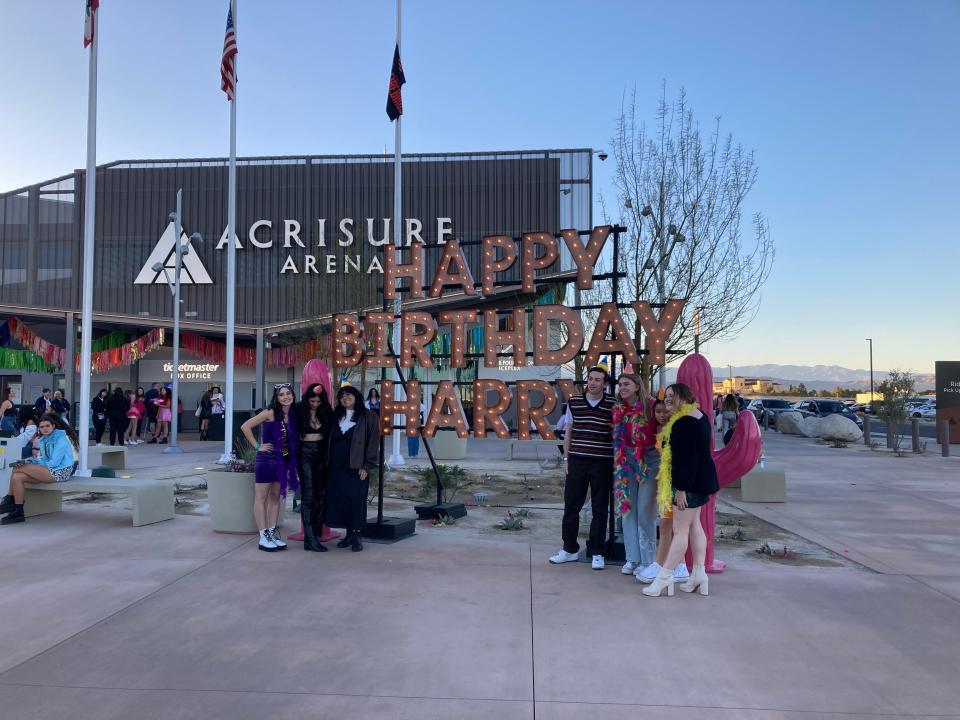 Fans take a photo in front of the "Happy Birthday Harry" sign outside Acrisure Arena ahead of the Harry Styles concert in Palm Desert, Calif. Wednesday, Feb. 1, 2023.