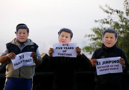 Tibetan activists wearing masks in the image of Chinese President Xi Jinping protest against what they say is Xi's oppressive rule in Tibet and the 19th National Congress of the Communist Party of China, in Kathmandu, Nepal, October 18, 2017. REUTERS/Navesh Chitrakar