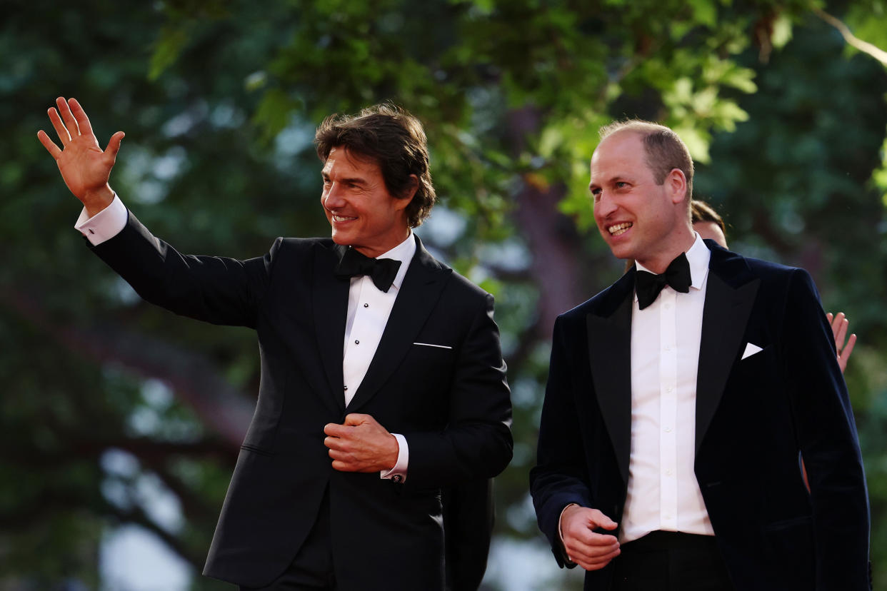 LONDON, ENGLAND - MAY 19: Prince William, Duke of Cambridge and actor Tom Cruise (L) acknowledge the crowd as they attend the 