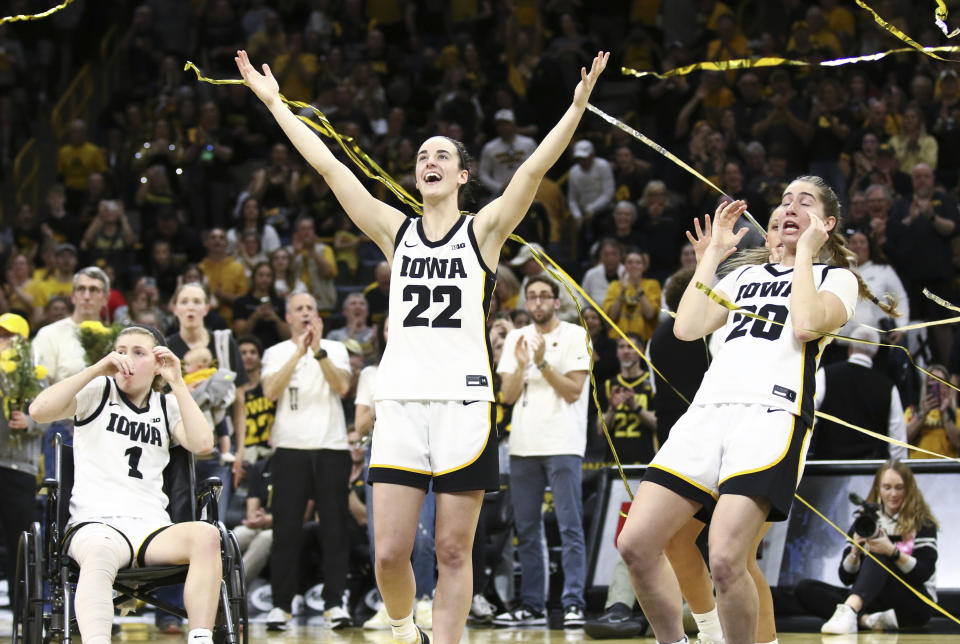 Iowa's Caitlin Clark celebrates in the confetti during senior day festivities after she broke Pete Maravich's all-time scoring record.  (Photo by Matthew Holst/Getty Images)