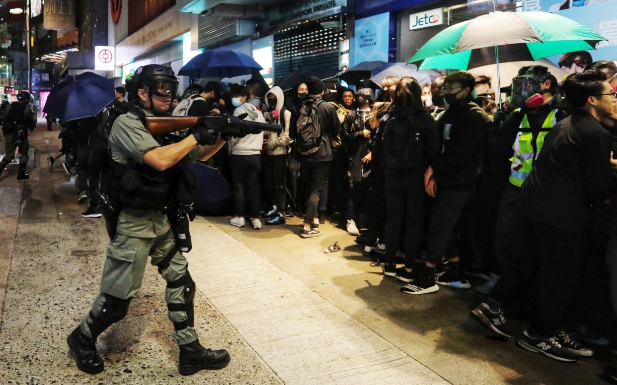 Riot police detain protesters during an anti-government rally on New Year's day in Hong Kong, China - REX