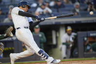 New York Yankees' Juan Soto (22) hits a double during the first inning of a baseball game against the Oakland Athletics on Thursday, April 25, 2024, in New York. (AP Photo/Bryan Woolston)