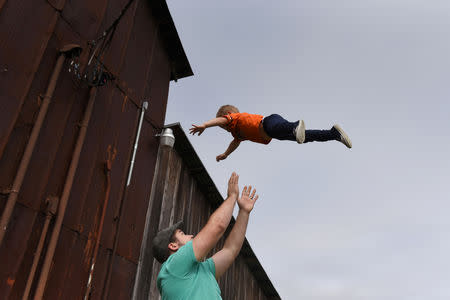 Will Hoffmann, husband of Lauren Hoffmann, plays with his two-year old son Asa at Sister Creek Vineyards in Boerne, Texas, U.S., February 16, 2019. REUTERS/Callaghan O'Hare