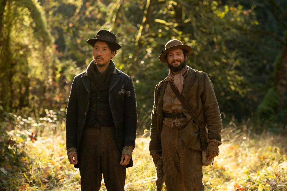 Orion Lee (left) and John Magaro (right) are 19th-century milk-stealing buds in the drama "First Cow."