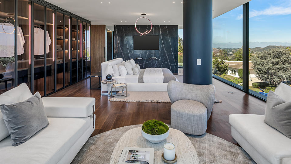 The primary bedroom with a gorgeous view and glass closet - Credit: Christopher Amitrano