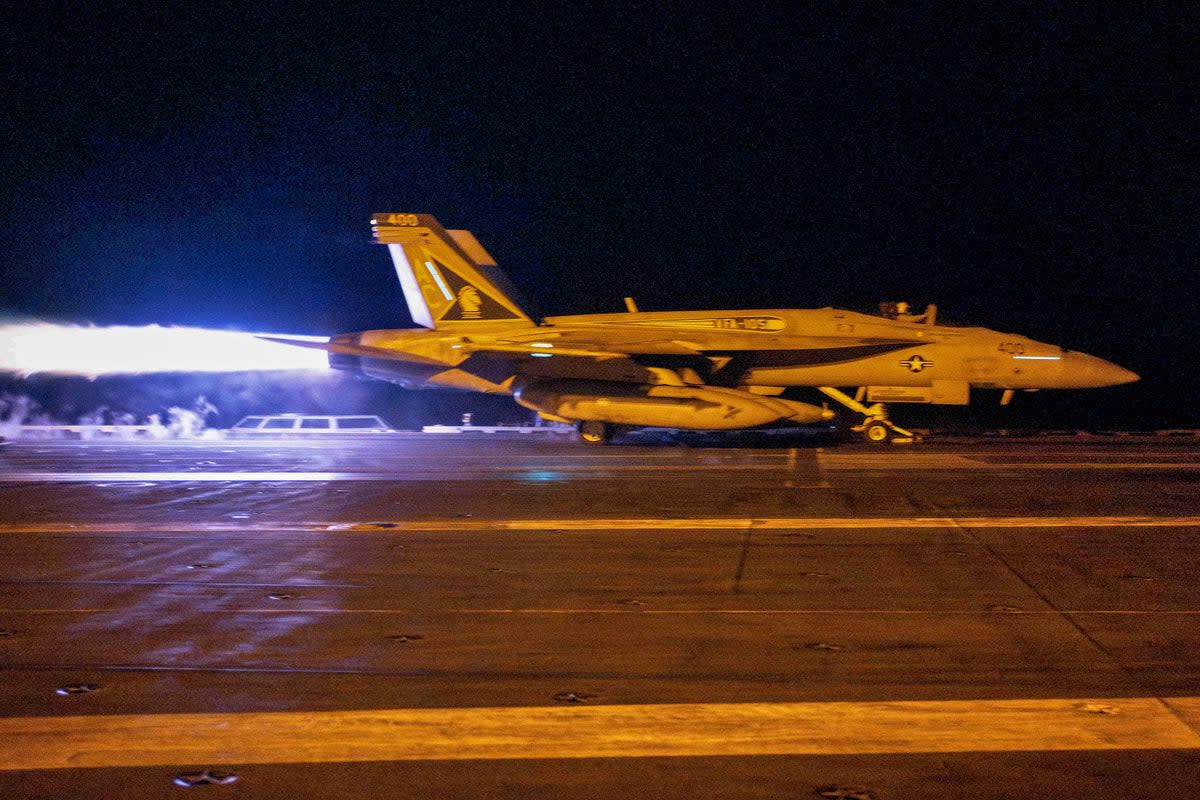 A fighter jet taking off from USS Dwight D. Eisenhower (CVN 69) during flight operations in response to increased Iranian-backed Houthi attacks on ships in the Red Sea (US NAVY/AFP/Getty)