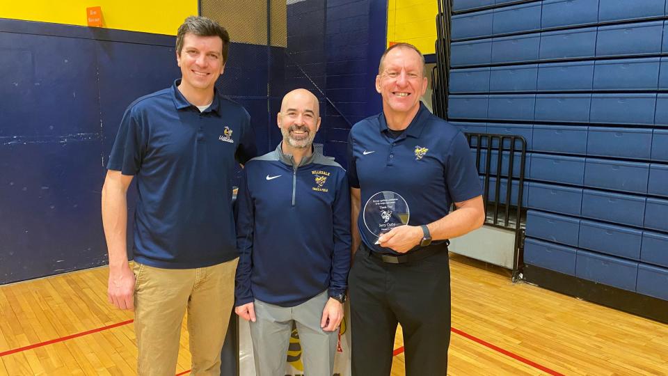 Hillsdale principal Josh Perrin (left) and Athletic Director David Pratt (center) recognized the efforts and contributions of coach and teacher Jerry Curby (right), who spearheaded the renovation of the Hornet Power weight room.