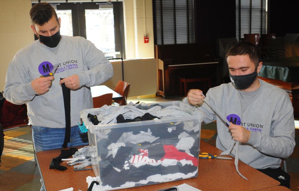 University of Mount Union students, from left, Joseph Haas and Jacob Buttar create pet toys that will be donated to the Humane Society. The pair worked on the project Saturday, Jan. 22, 2022.