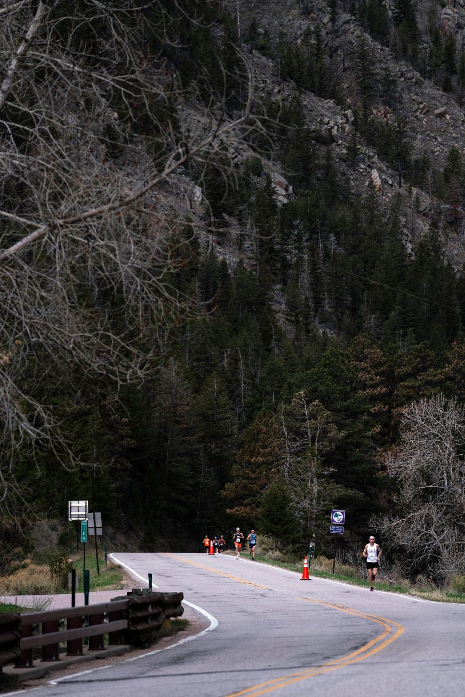 Marathon runners come down Poudre Canyon during the Colorado Marathon on Sunday, May 7, 2023.