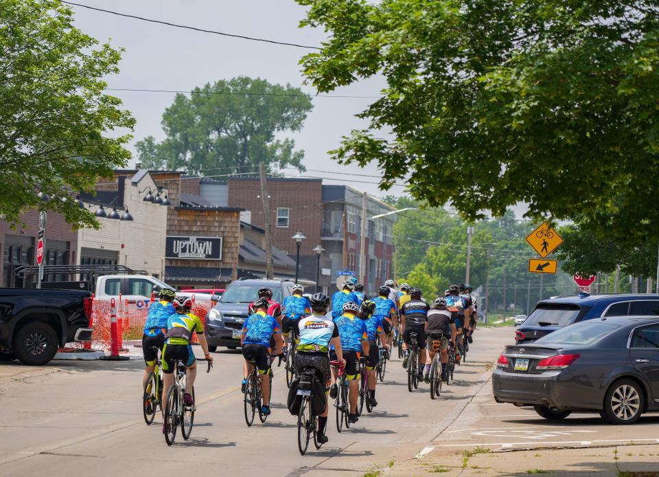 Riders roll through Ankeny during the RAGBRAI route inspection ride in June.