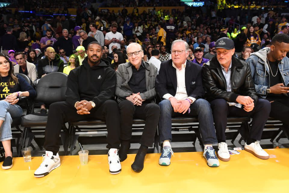 (L to R) Michael B. Jordan, Bill Maher, David Zaslav and Woody Harrelson poses for a photo in Game Six of the Western Conference Semi-Finals of the 2023 NBA Playoffs between Golden State Warriors against the Los Angeles Lakers on May 12, 2023 at Crypto.com Arena in Los Angeles, California.