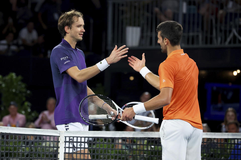 Serbia's Novak Djokovic is congratulated at the net after defeating Russia's Daniil Medvedev during their semi final match at the Adelaide International Tennis tournament in Adelaide, Australia, Saturday, Jan. 7, 2023. (AP Photo/Kelly Barnes)