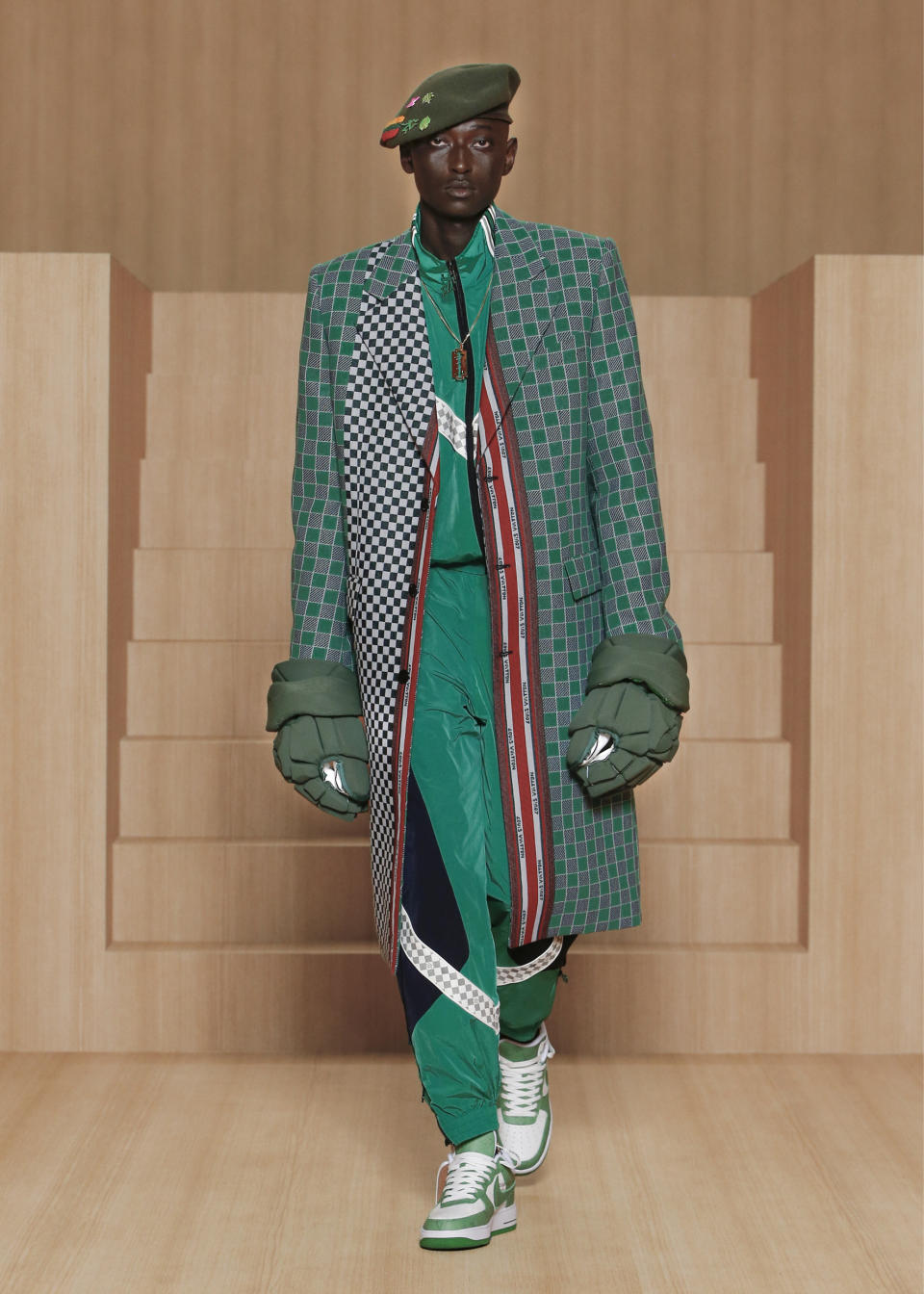 Tracksuits and tailored coats at Louis Vuitton spring ’22 men’s. - Credit: Ludwig BONNET-JAVA/Louis Vuitton