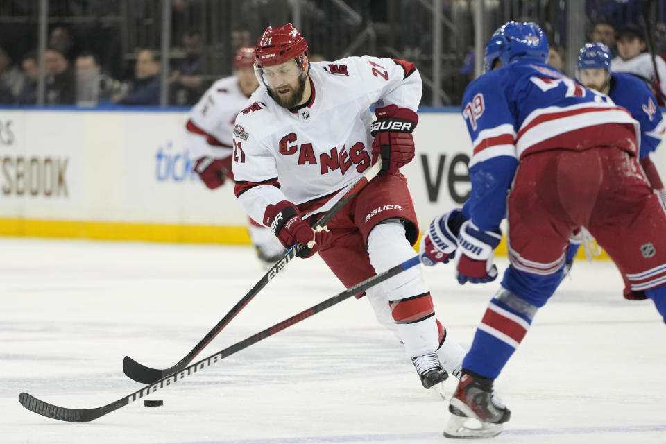 Carolina Hurricanes center Derek Stepan (21) skates against New York Rangers defenseman K'Andre Miller (79) during the third period of an NHL hockey game Tuesday, March 21, 2023, at Madison Square Garden in New York. The Hurricanes won 3-2. (AP Photo/Mary Altaffer)