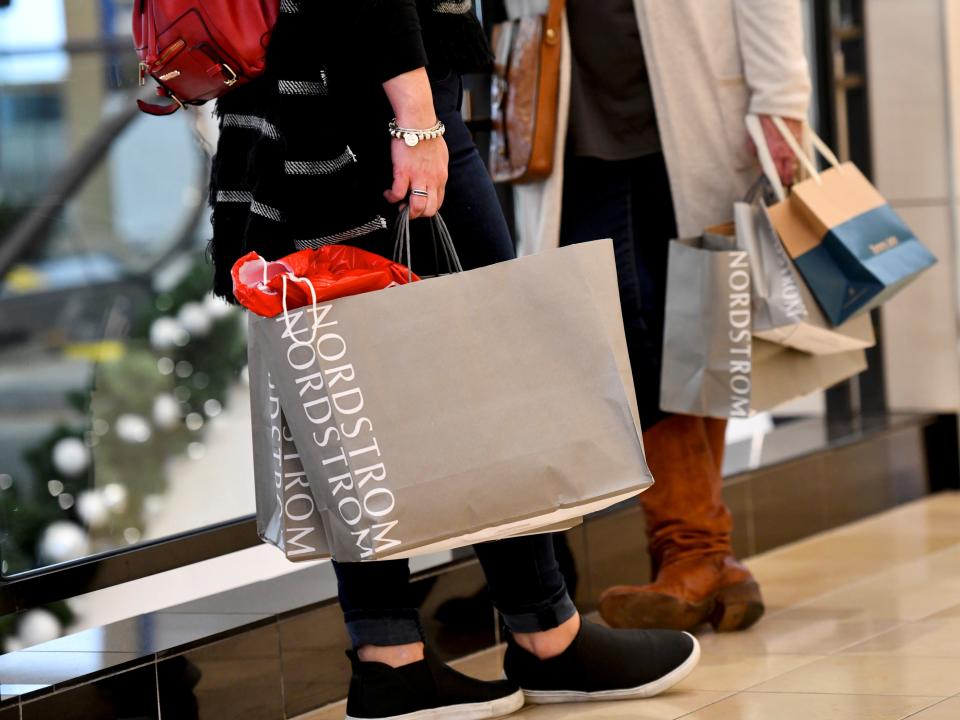FILE PHOTO: Shoppers clutch their Nordstrom bags as pre-Thanksgiving and Christmas holiday shopping accelerates at the King of Prussia Mall in King of Prussia, Pennsylvania, U.S. November 22, 2019. REUTERS/Mark Makela