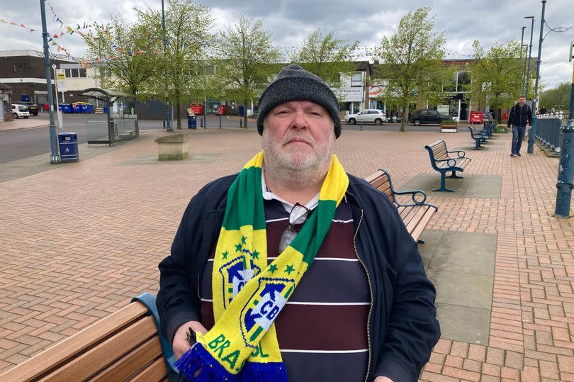 Peter Ashley, sat waiting for a bus next to the canal in Stalybridge's centre