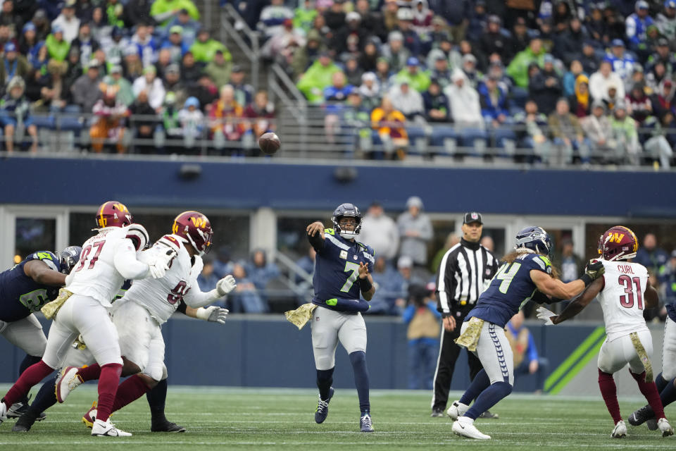 Seattle Seahawks quarterback Geno Smith (7) looks to pass in the first half of an NFL football game against the Washington Commanders in Seattle, Sunday, Nov. 12, 2023. (AP Photo/Lindsey Wasson)