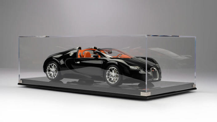 Amalgam Collection&#x002019;s Bugatti Veyron Grand Sport Scale Model in the case. - Credit: Amalgam Collection