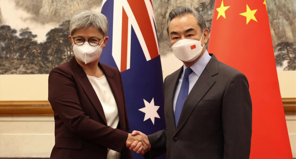 Foreign Ministers Penny Wong and Wang Yi shake hands on Wednesday. Source: Penny Wong