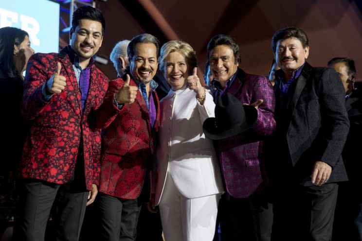 Hillary Clinton poses with members of the band Los Tigres del Norte at a debate watch party in North Las Vegas, Nev. ( Photo: Andrew Harnik)