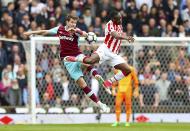 <p>West Ham United’s Havard Nordtveit, left, and Stoke City’s Saido Berahino battle for the ball </p>