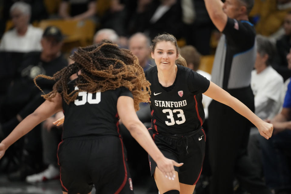 Stanford guard Haley Jones, front, congratulates guard Hannah Jump who hit a 3-point basket against Colorado in the second overtime of an NCAA college basketball game Thursday, Feb. 23, 2023, in Boulder, Colo. (AP Photo/David Zalubowski)