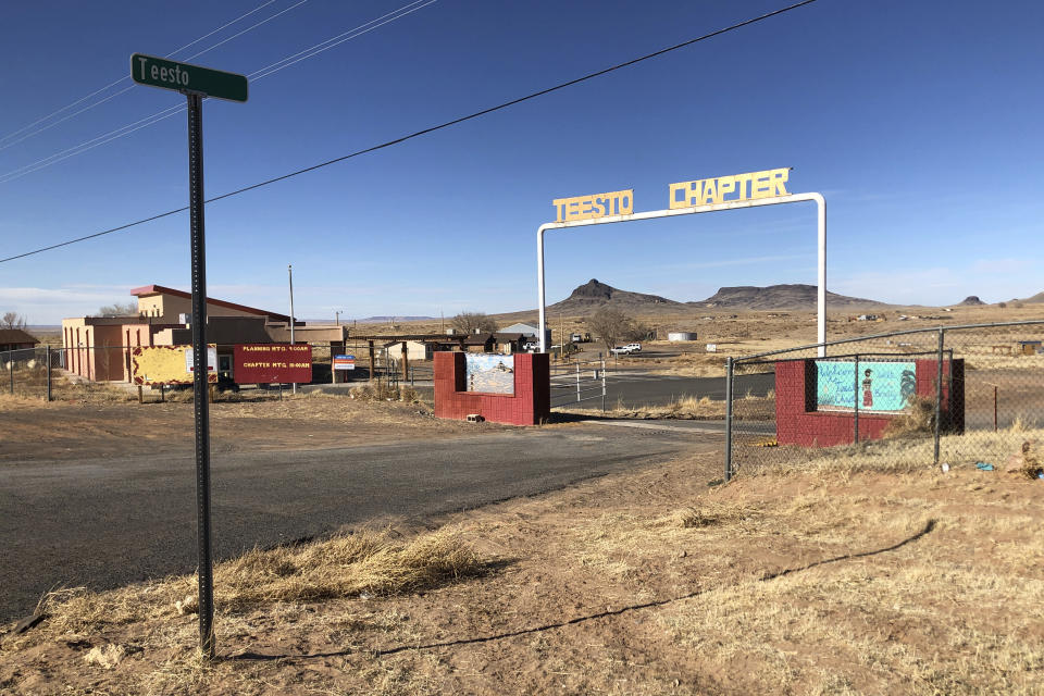 The entrance to the Teesto Chapter in Teesto, Ariz., on the Navajo Nation is seen on Feb. 11, 2021. Teesto workers, health representatives, volunteers and neighbors keep close tabs on another to ensure the most vulnerable citizens get the help they need. (AP Photo/Felicia Fonseca)