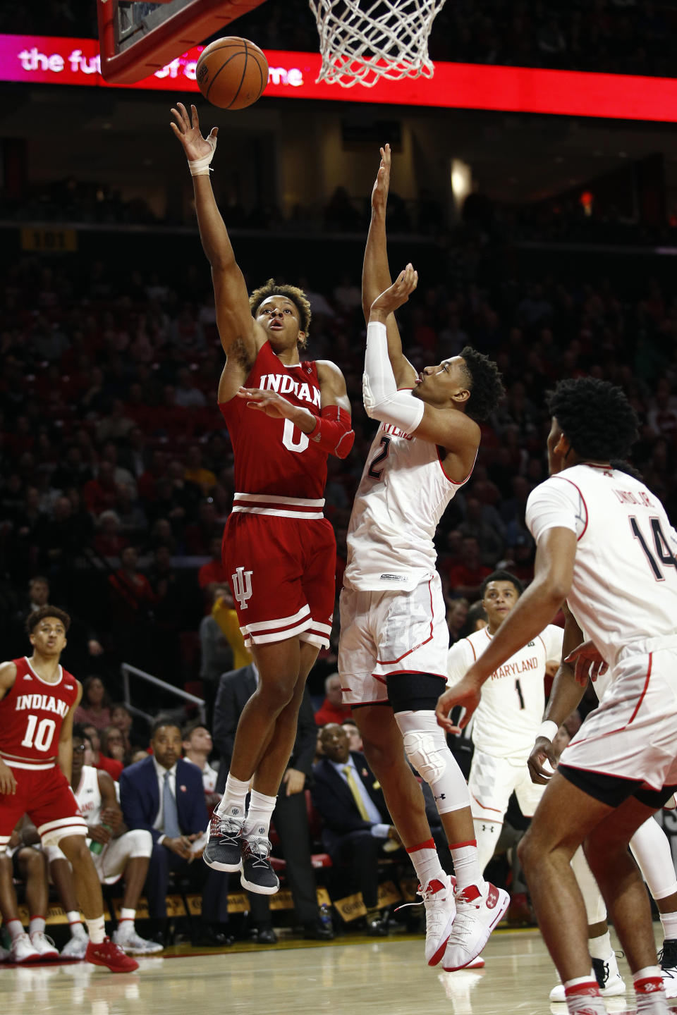 Indiana guard Romeo Langford, left, shoots over Maryland guard Aaron Wiggins in the first half of an NCAA college basketball game, Friday, Jan. 11, 2019, in College Park, Md. (AP Photo/Patrick Semansky)