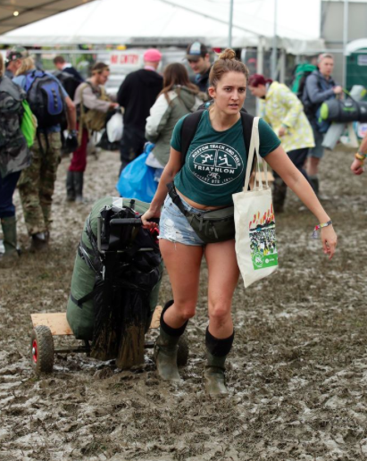 Not everyone wore ponchos or rainproof gear - this woman is defiantly dressing for summer. (PA)