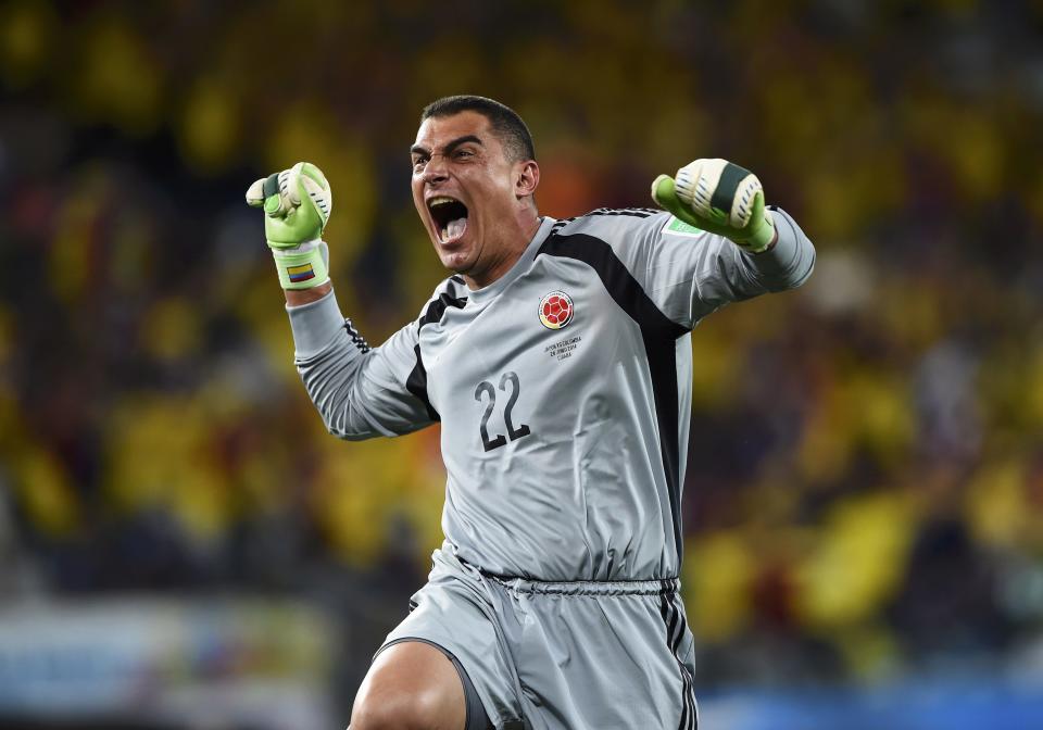 Colombia's goalkeeper Faryd Mondragon celebrates his team's fourth goal against Japan during their 2014 World Cup Group C soccer match at the Pantanal arena in Cuiaba June 24, 2014. REUTERS/Dylan Martinez (BRAZIL - Tags: SOCCER SPORT WORLD CUP)