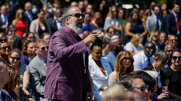 PHOTO: Manuel Oliver, whose son Joaquin was killed in the Parkland mass shooting, interrupts President Joe Biden as he delivers remarks at an event to celebrate the Bipartisan Safer Communities Act on the South Lawn of the White House, July 11, 2022. (Chip Somodevilla/Getty Images)