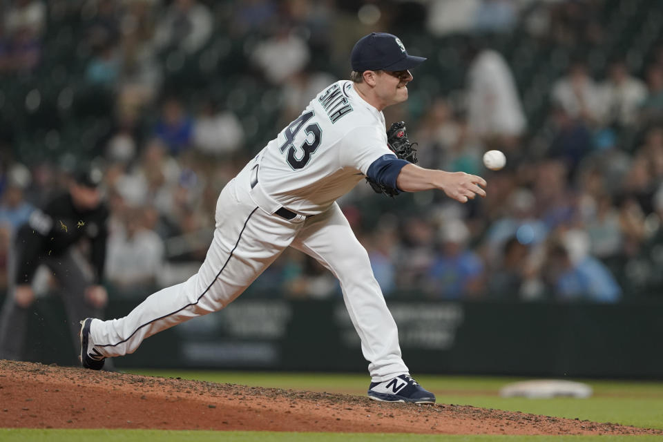 Seattle Mariners pitcher Joe Smith throws to a Houston Astros batter during the seventh inning of a baseball game, Tuesday, July 27, 2021, in Seattle. Smith was traded to the Mariners from the Astros earlier in the day. (AP Photo/Ted S. Warren)