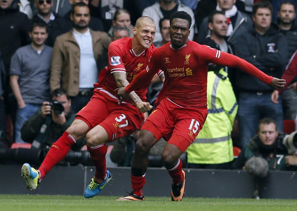 Liverpool's Sturridge celebrates scoring against Manchester United with Martin Skrtel during their English Premier League soccer match at Anfield