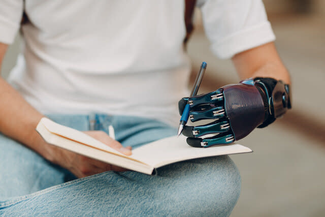 Prosthetic hand holding pen