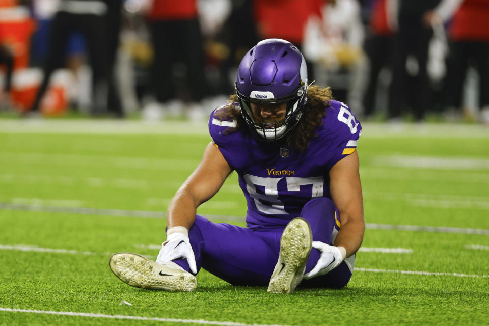 Minnesota Vikings tight end T.J. Hockenson (87) sits on the field after getting injured. (AP Photo/Bruce Kluckhohn)