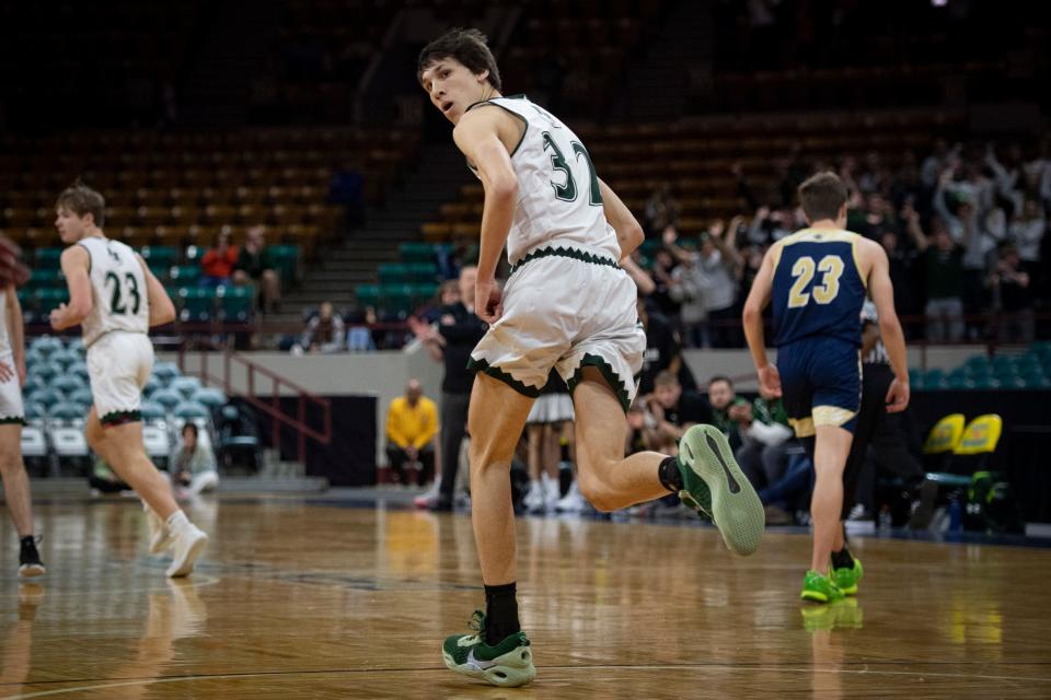 Fossil Ridge's Nick Randall heads back on defense after scoring a bucket against Legacy during the 5A Boys Great 8 game at the Denver Coliseum on Saturday, March 5, 2022.