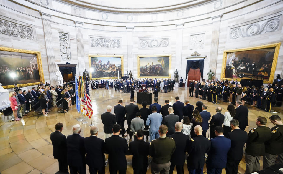 Guests attend a ceremony as the remains of retired Army Col. Ralph Puckett Jr., the last surviving Medal of Honor recipient for acts performed during the Korean War, lie in honor in the Rotunda at the Capitol in Washington, Monday, April 29, 2024. Puckett died on April 8 at his home in Columbus, Ga., at the age of 97. (Shawn Thew, Pool Photo via AP)
